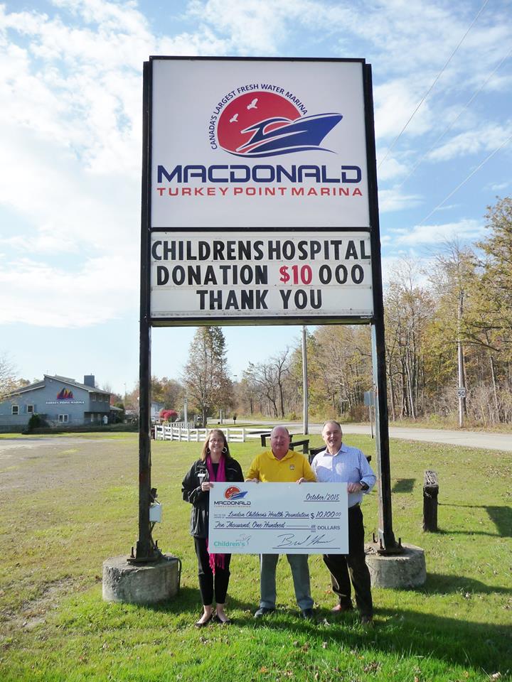 Brad Thomson delivers cheque of donations.